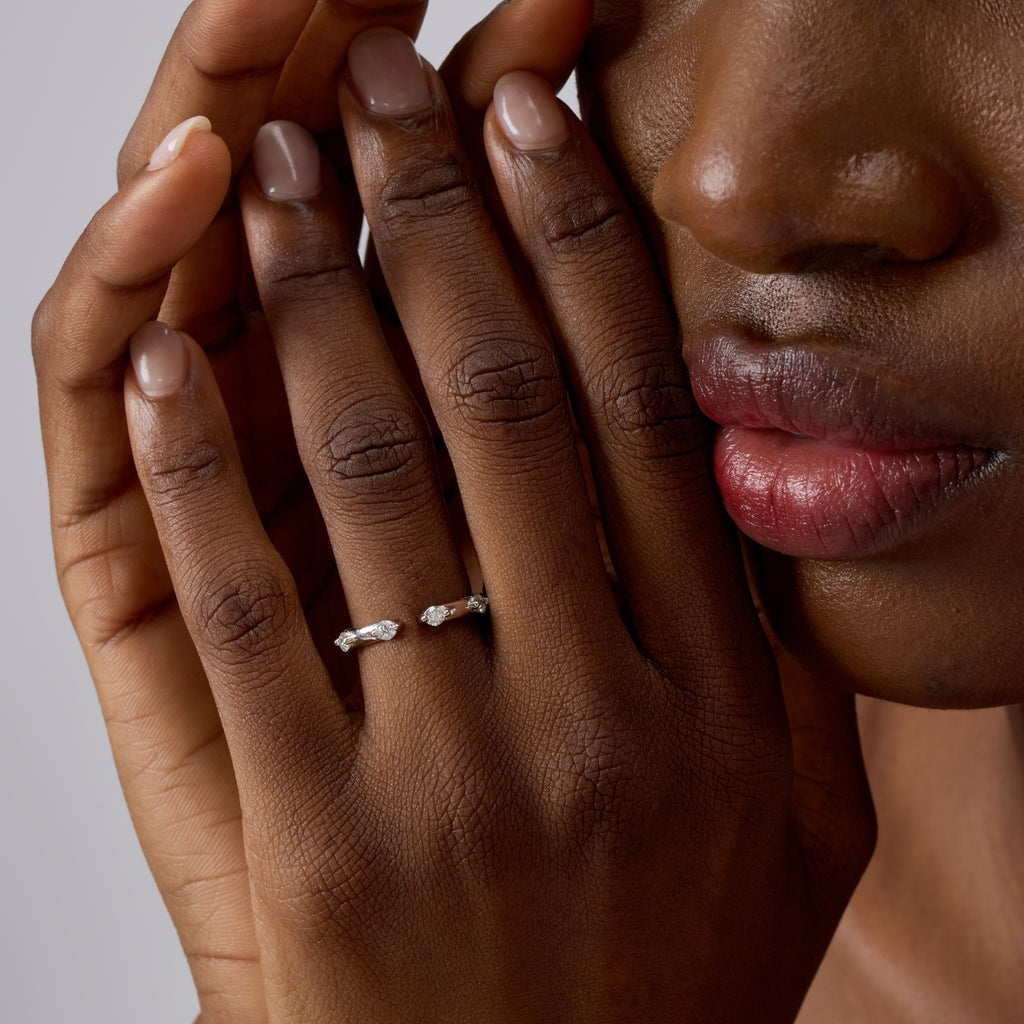 Close-up of Club Lux Stackable Open Band Ring showing four stones, rhodium plated 925 silver, cubic zirconia.