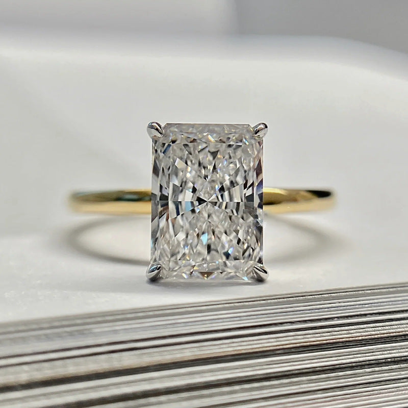 Club Lux 5.5 Carat Radiant Cut Engagement Ring on Table – 18K Gold and Rhodium Plated Two Tone over 925 Sterling Silver, Crushed Ice CZ