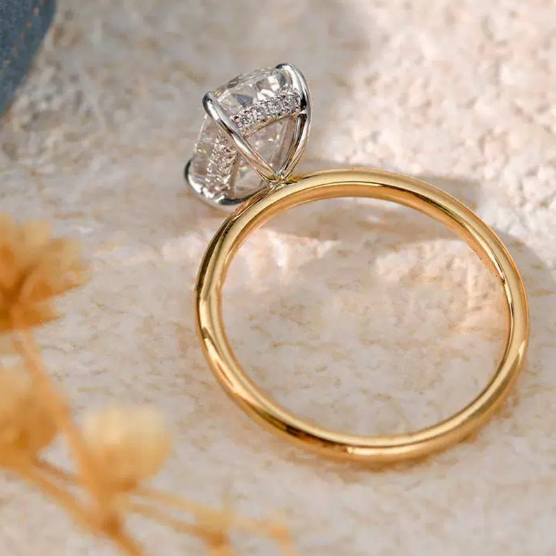 Side view Club Lux 3 Carat Elongated Cushion Ring showing hidden halo, gold band & white prongs