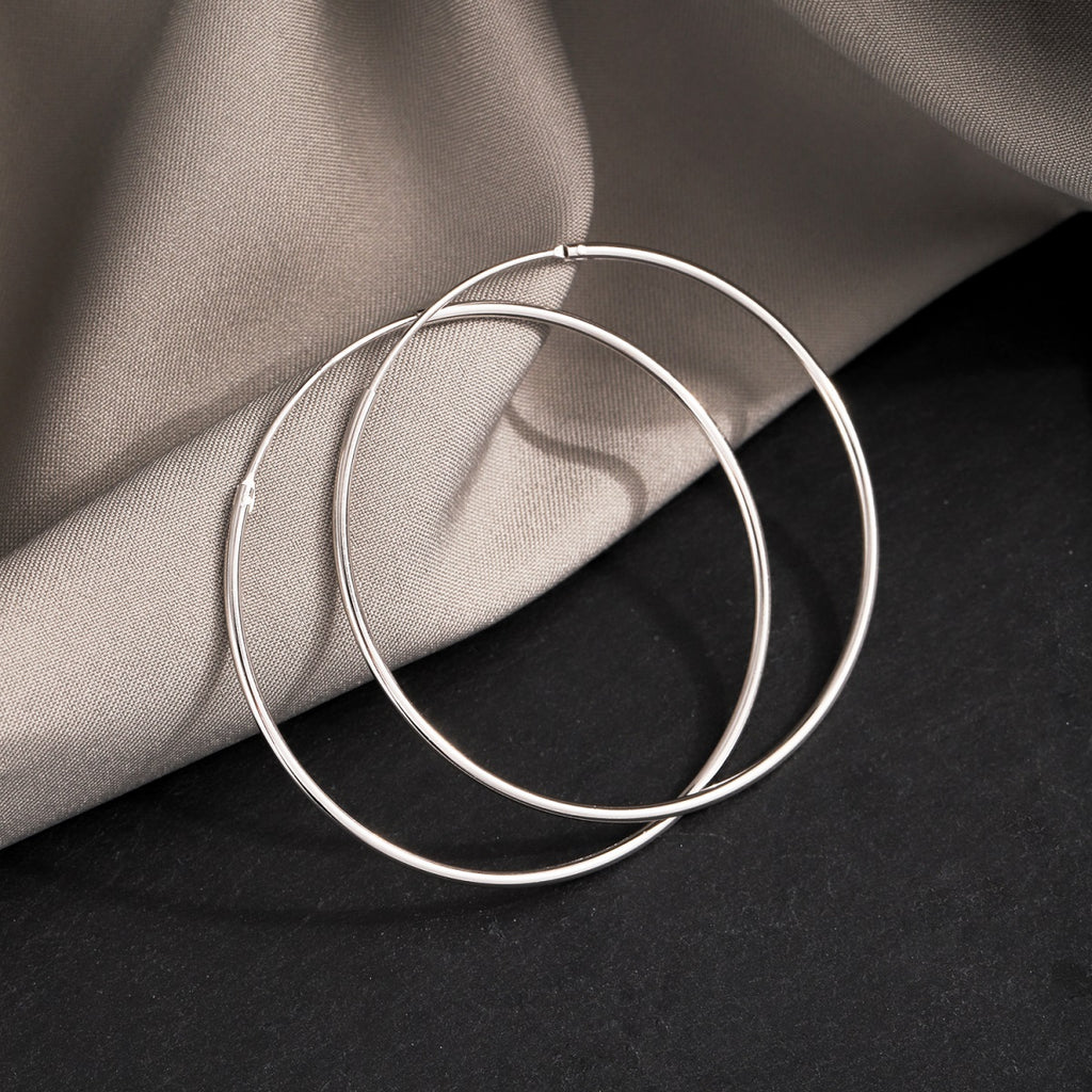 Make a versatile statement with our medium or large circle endless infinite hoops earrings — cutesy for the everyday or fancy for when it matters!