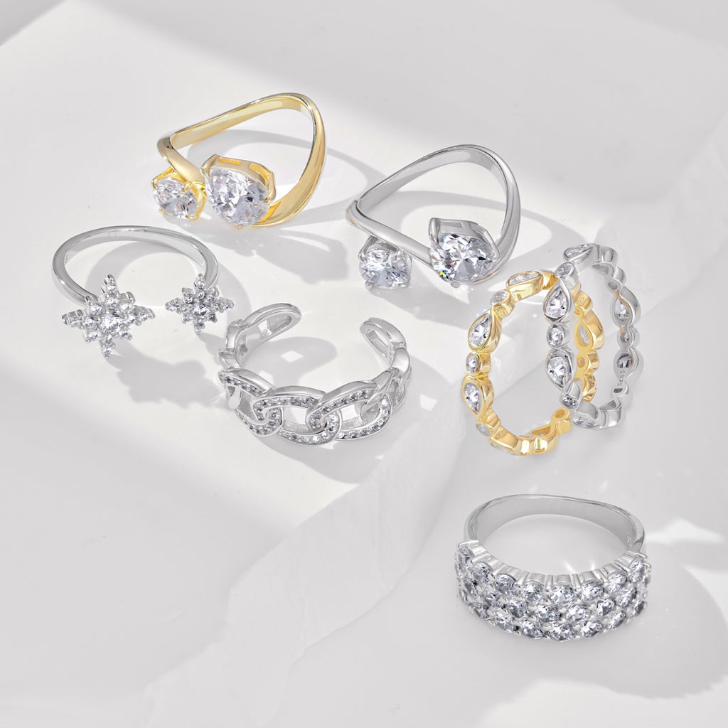 This ultra-glam, classy full eternity band sparkles with alternately bezel-set pear and round brilliant cut cubic zirconias in a wavy line - perfect for a wedding band or stackable ring. Fabulous and unique!  Choose your bling: Gold or Silver Band!