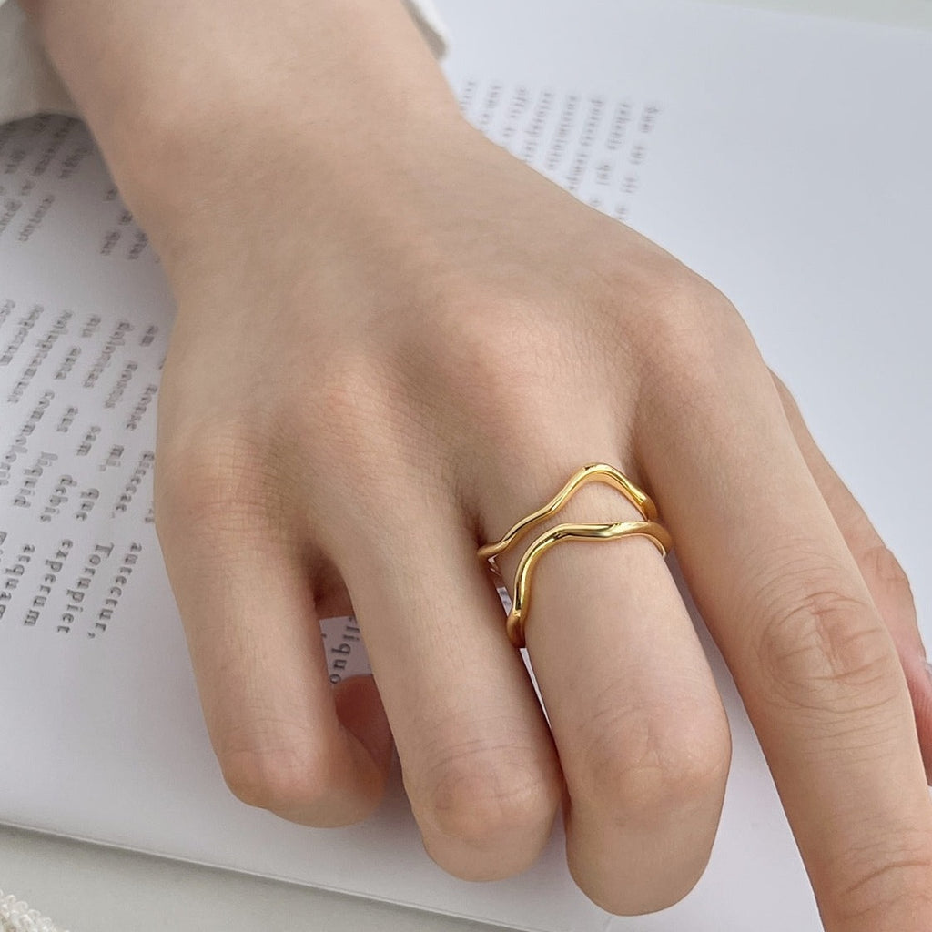 A seamless blend of statement and stackable styles!  A modern, sculptural piece for your ring collection! Inspired by the organic curves and shapes of nature, this ring will leave you feeling fluidly fabulous when worn. Sparkle in Gold or Silver shade!