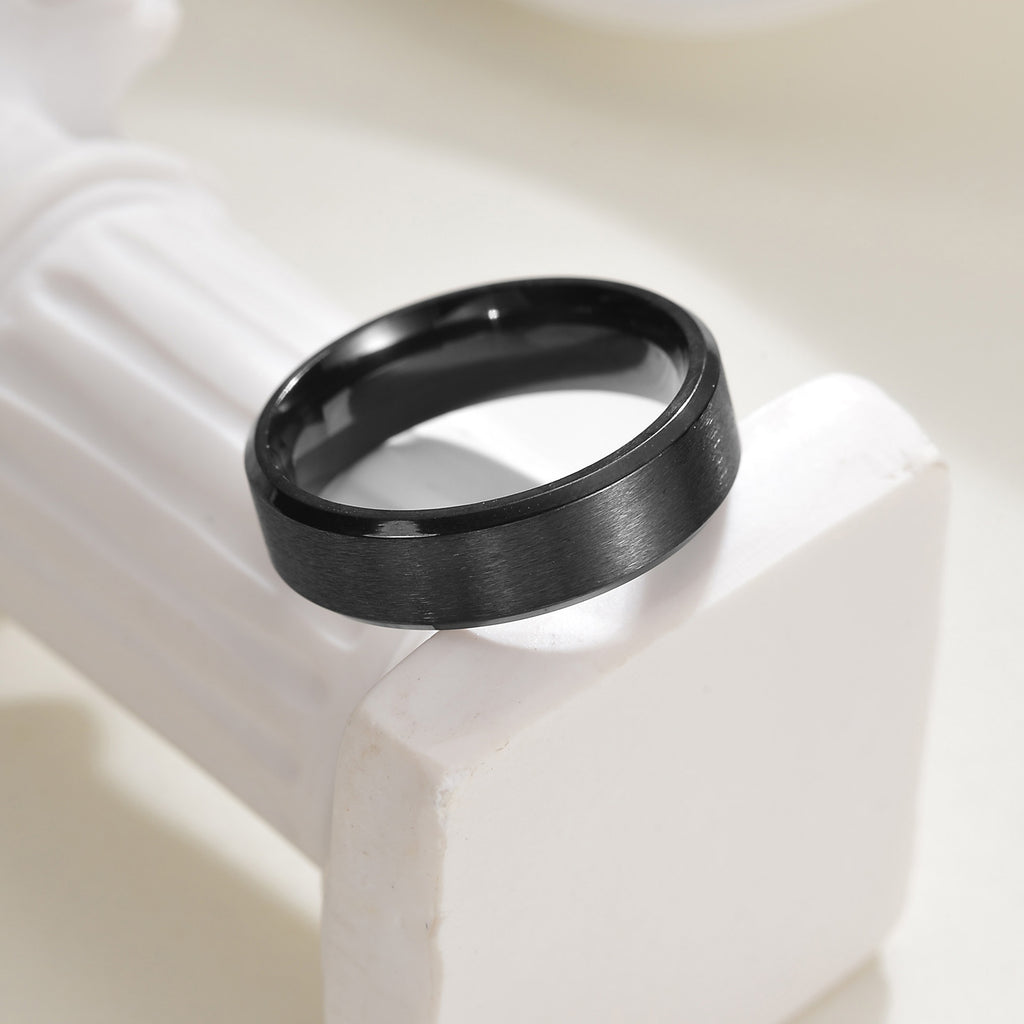 Front view of black titanium wedding band showing inner comfort-fit design