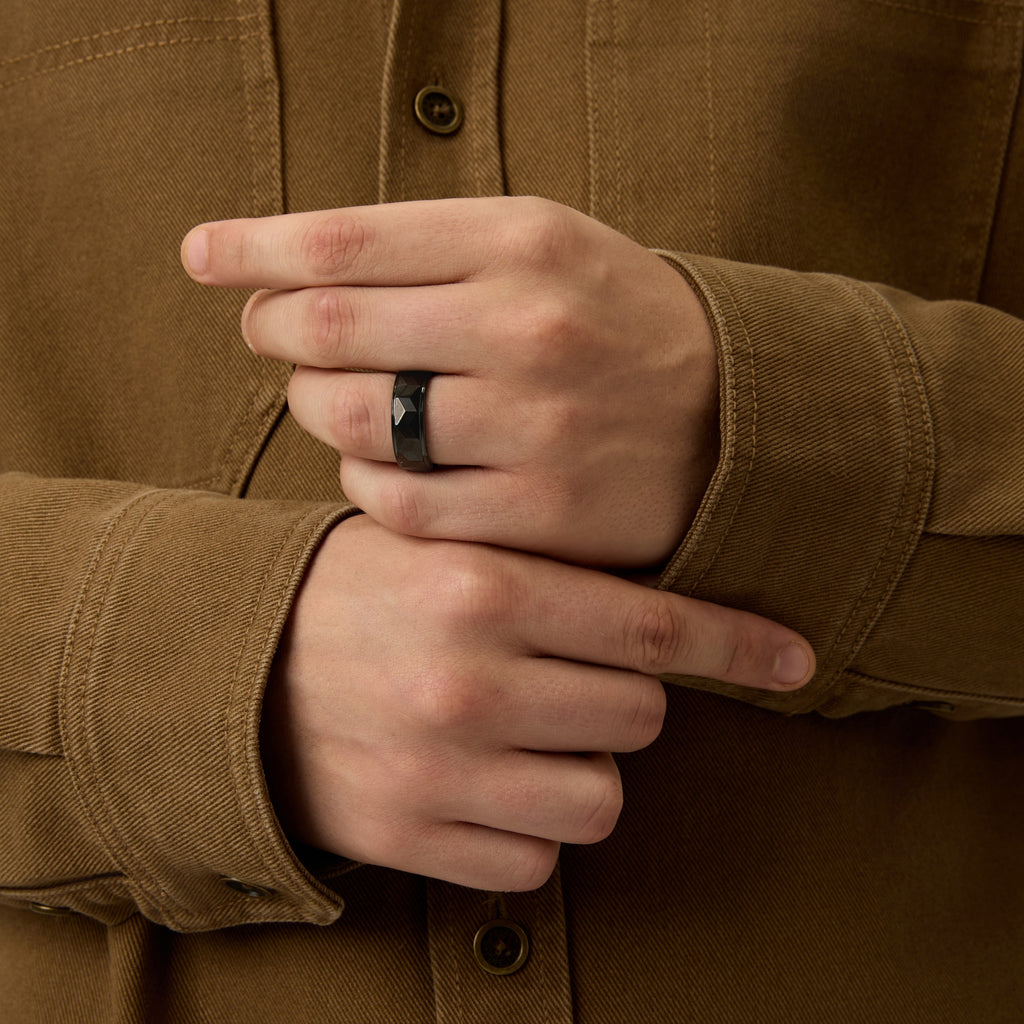 Detailed close-up of Club Lux Men’s Black Tungsten Ring 8mm Faceted Wedding Band on hand, showcasing shine and craftsmanship.