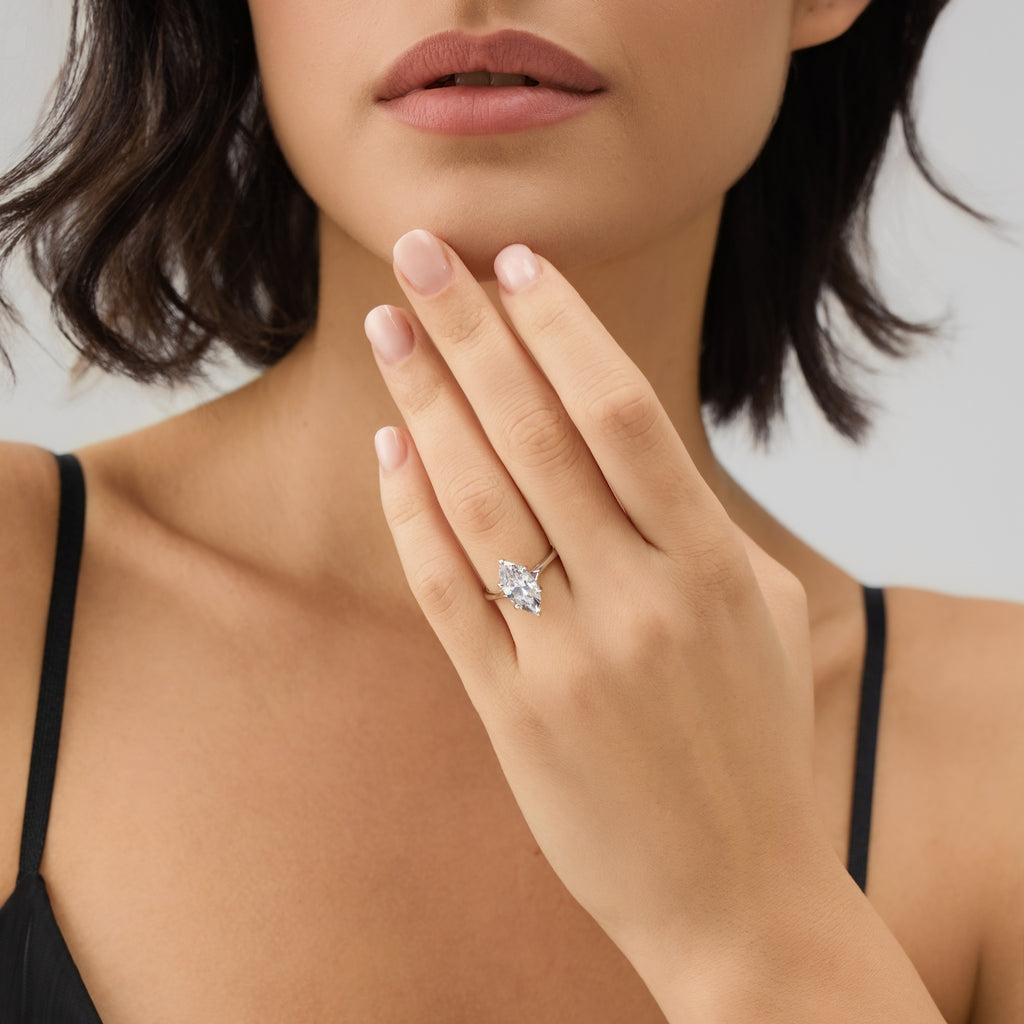 Woman wearing 3 Carat Marquise Solitaire Engagement Ring – front view showcasing the diamond-like sparkle and timeless solitaire design.