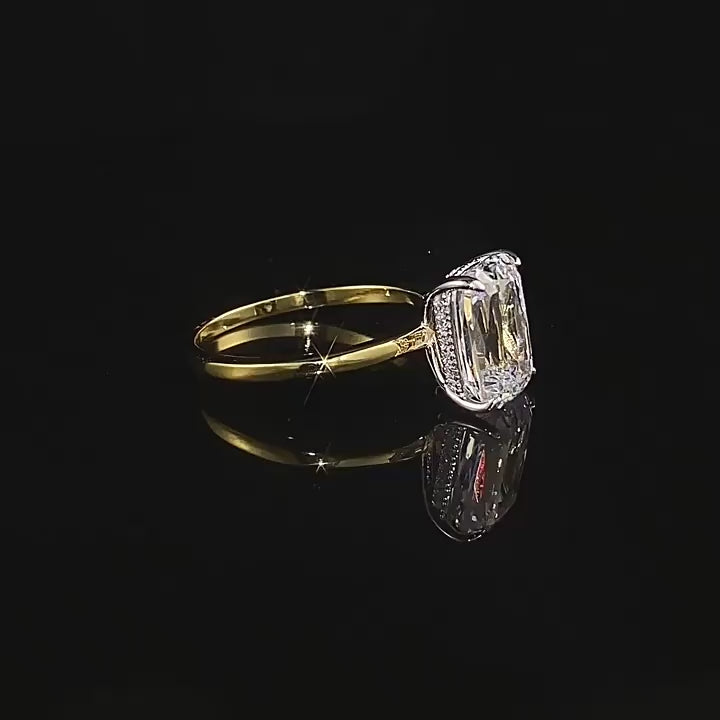 360° view of Club Lux 3 Carat Elongated Two Tone Cushion Solitaire Engagement Ring in 18K gold and rhodium-plated sterling silver with simulated diamonds, showing all angles and sparkle