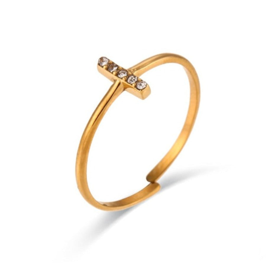 This dainty T Bar Ring is a popular trending style for stackable or style as a midi ring, featuring five cubic zirconia crystals set on a vertical bar.